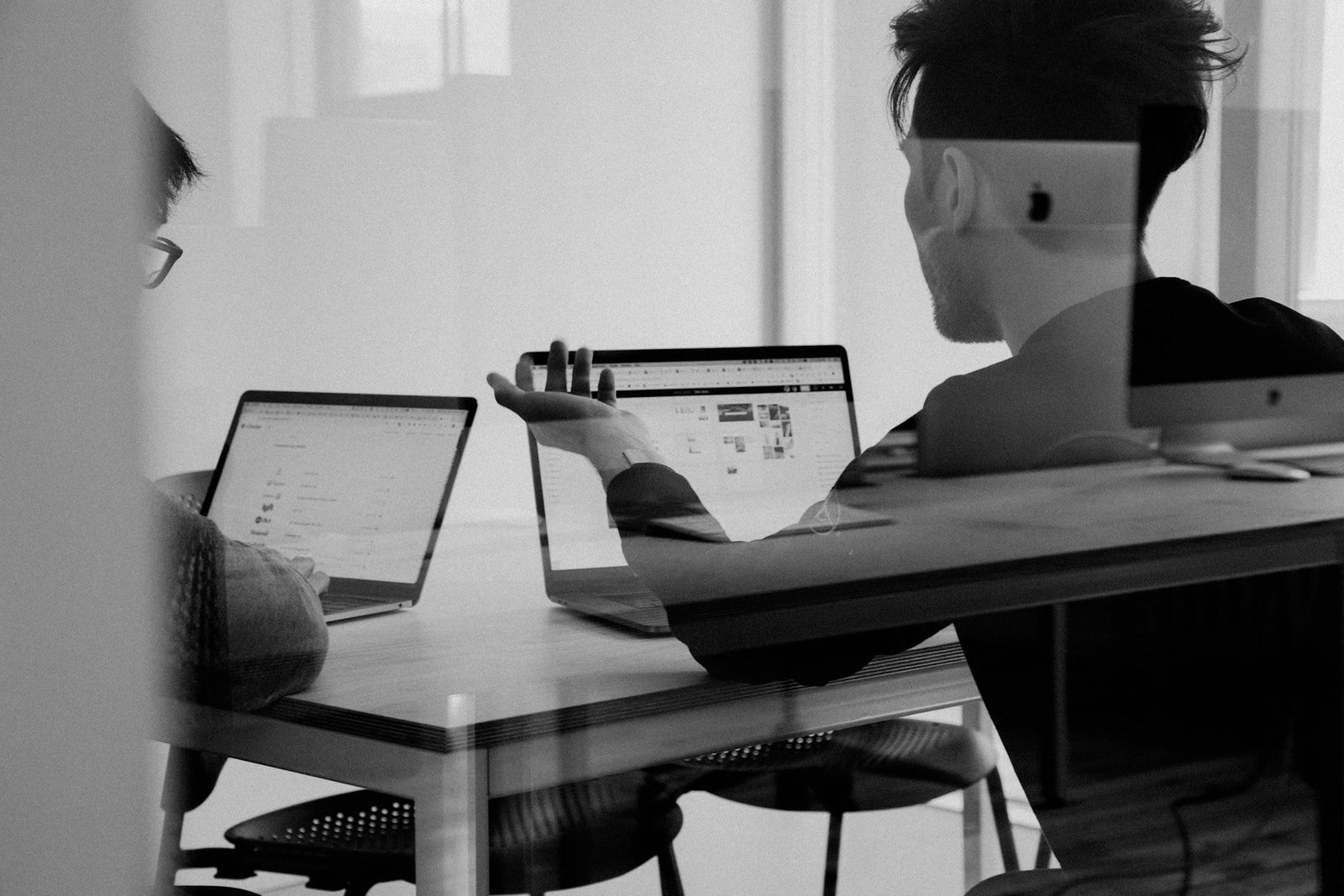 Pharm bio consulting a man sitting at a table with a laptop